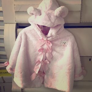 Vintage pink fur coat with pink satin liner.